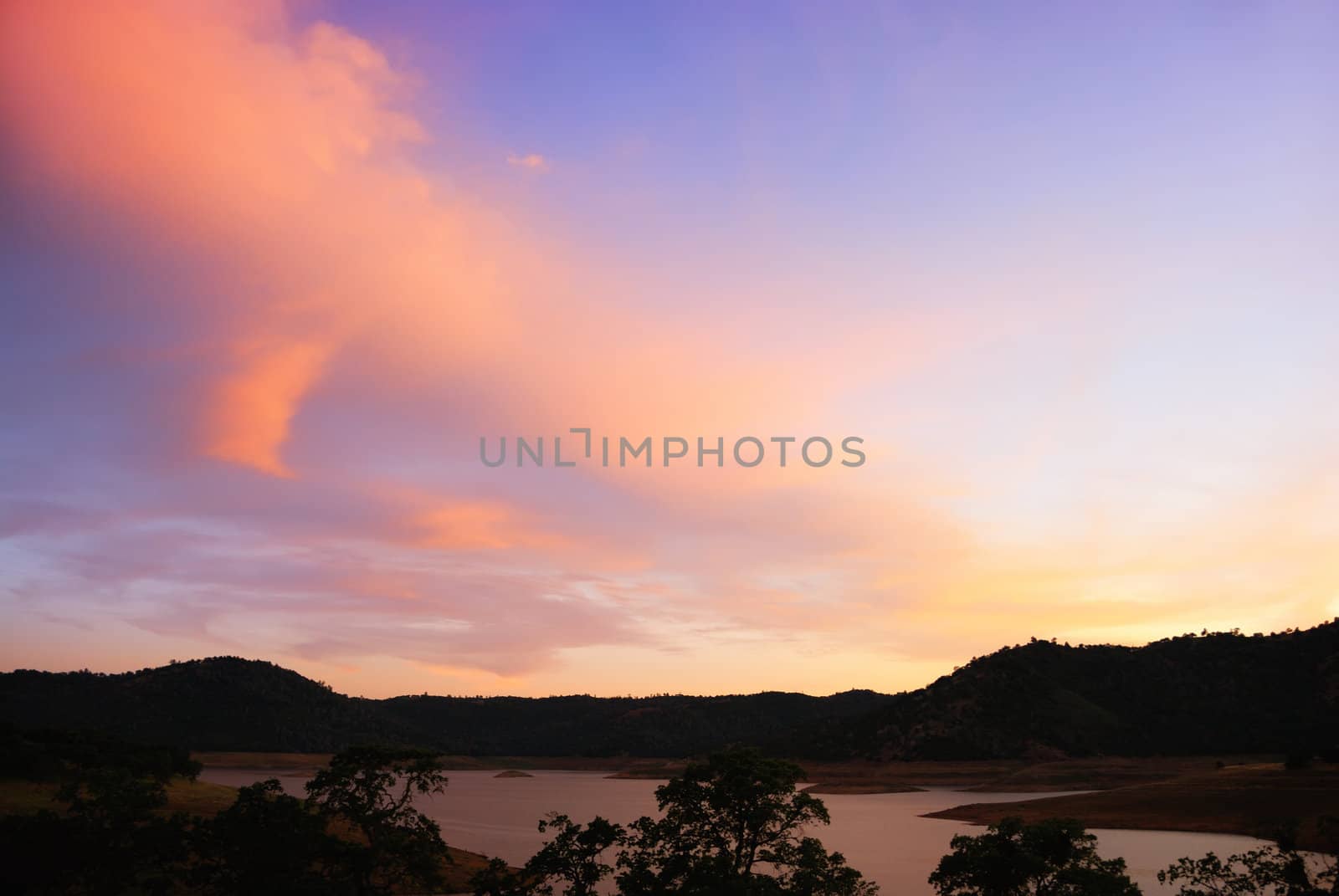 Blue and purple sunset above the New Melones Lake in California.