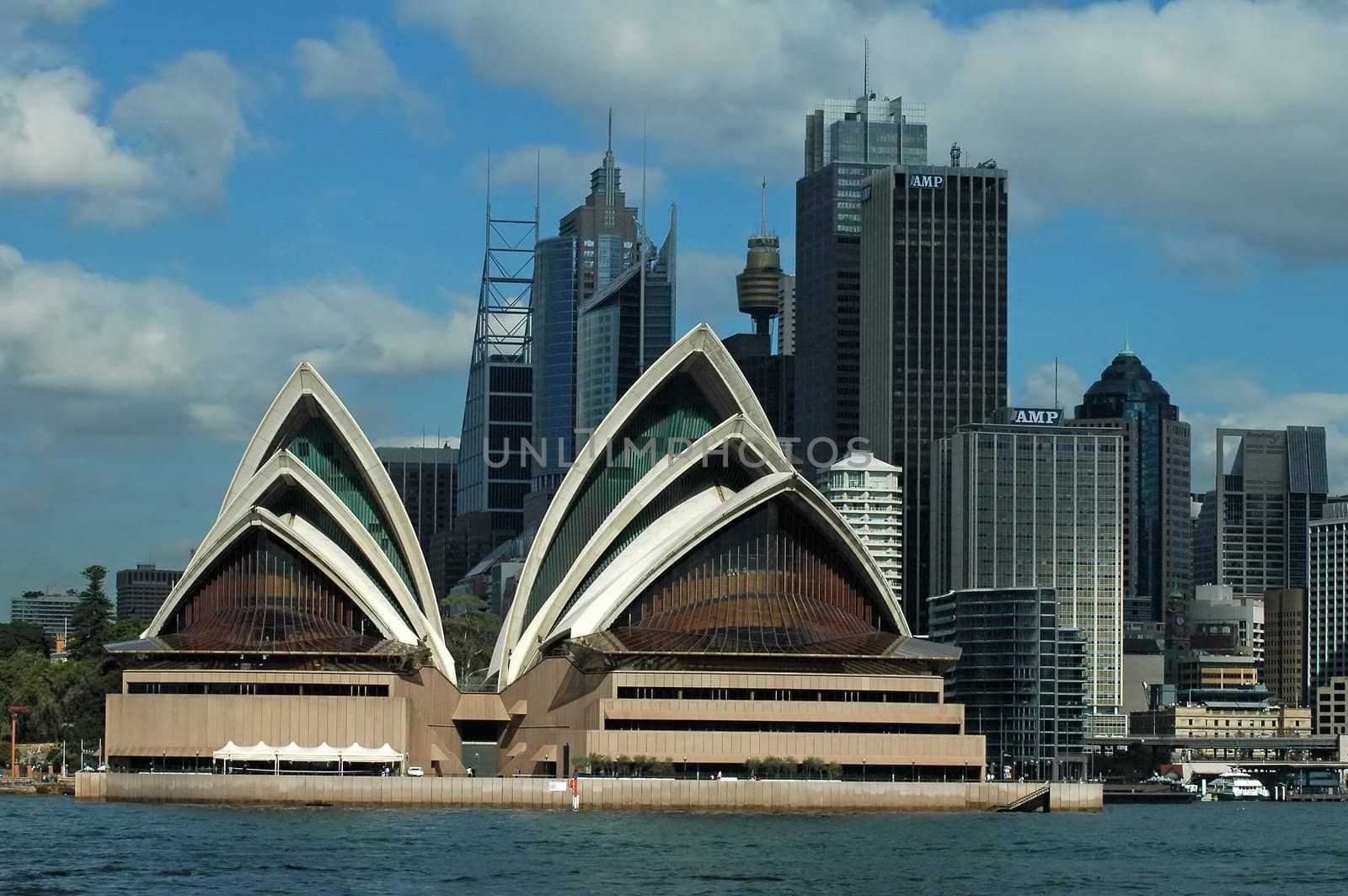 opera house in sydney, photo taken from kirribilli, sydney tower in background