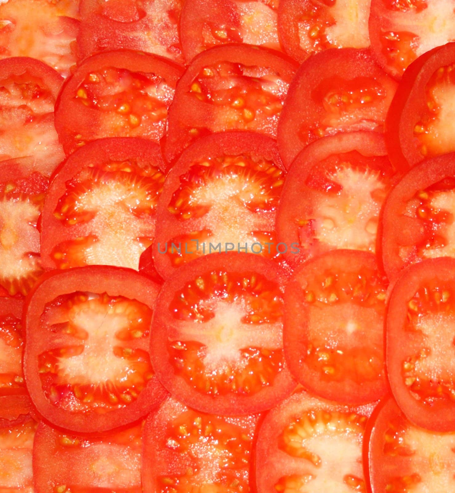 Tomatoes red and fresh cut on segments
