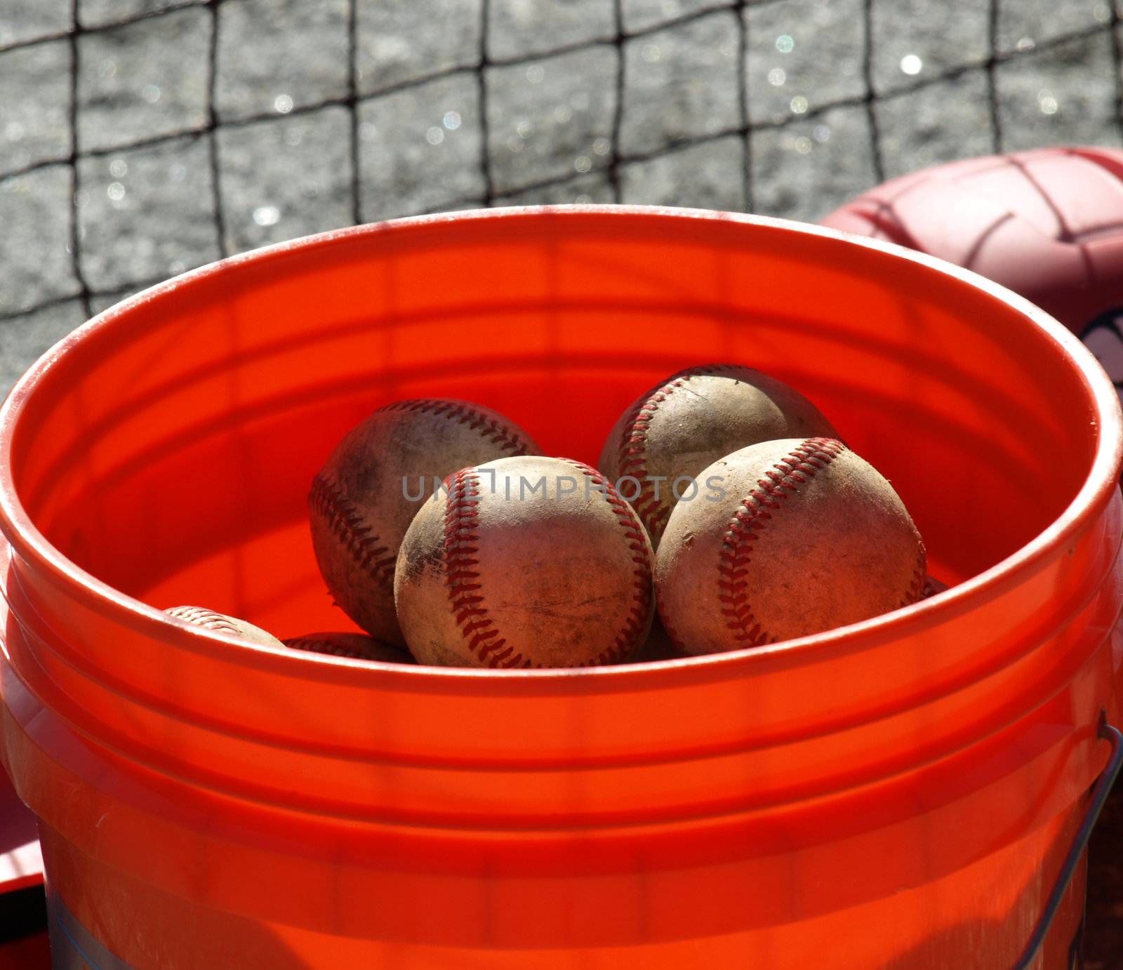 a closeup view of an orange ball bucket 