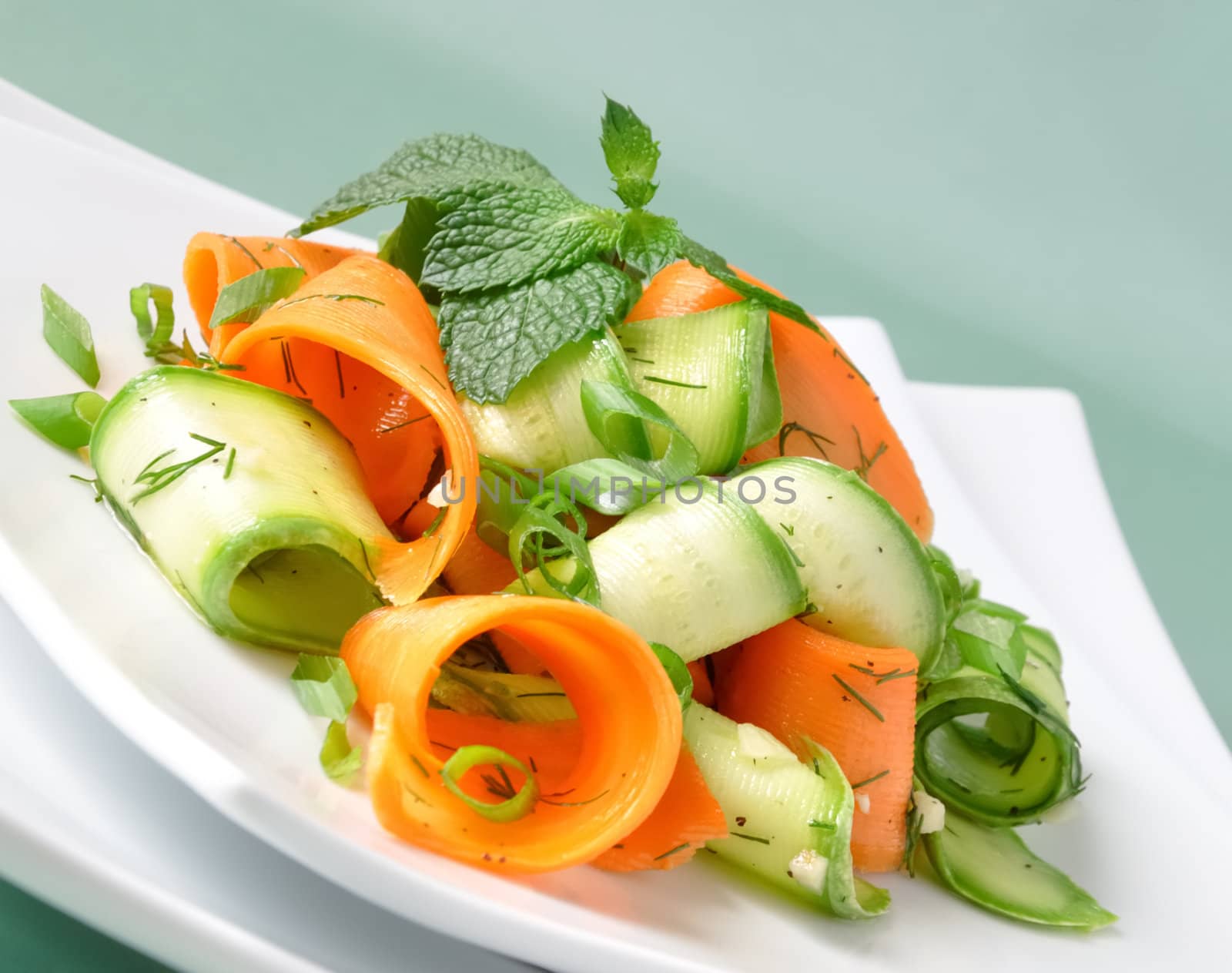 Zucchini salad with carrots and garlic marinade with herbs