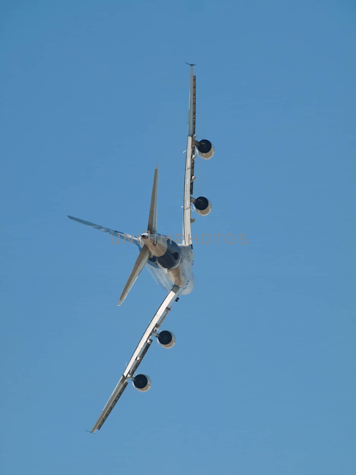 Rear profile of an aircraft  flying in blue sky