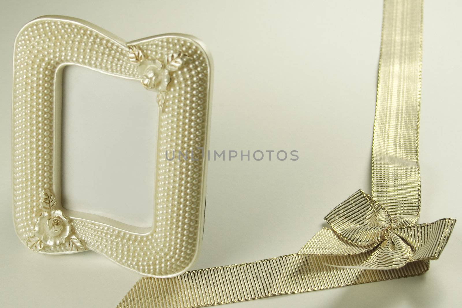 golden ribbon and pearl picture frame by leafy