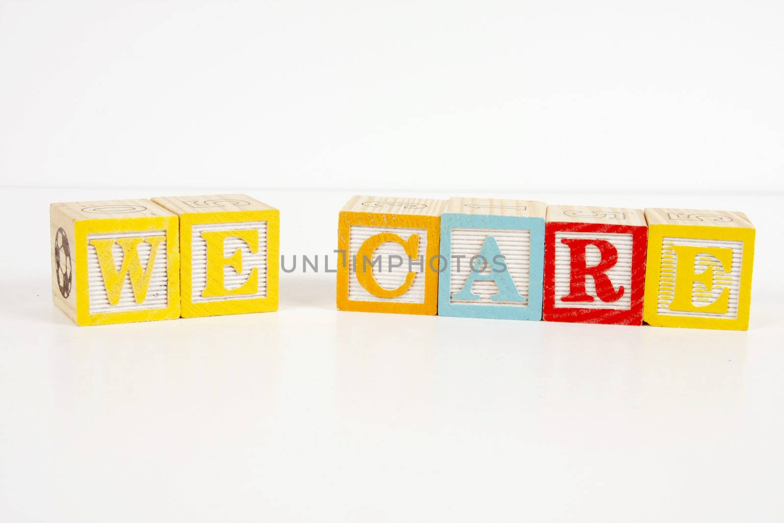 Colorful childrens blocks spell the words we care.