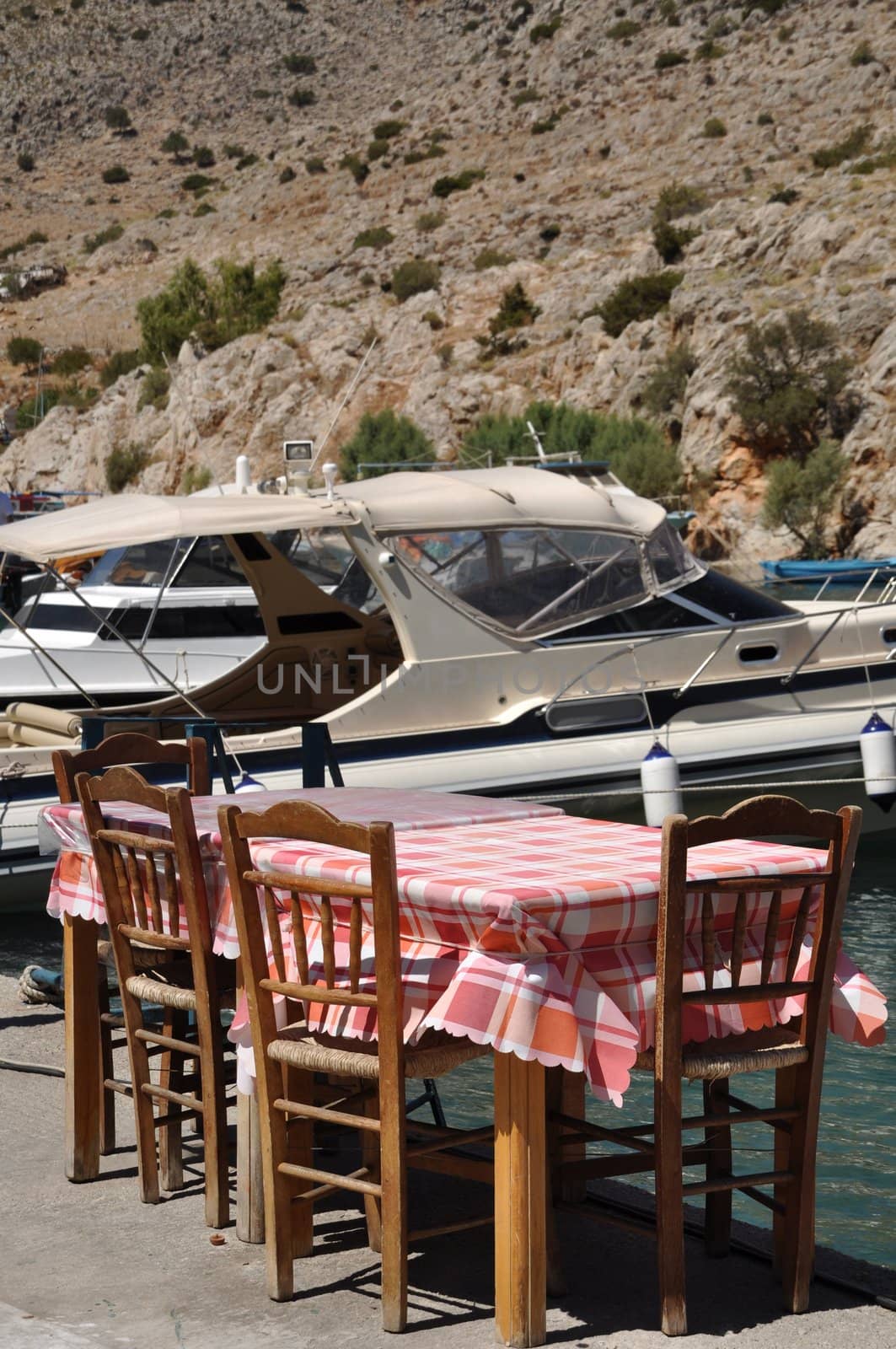 typical outdoor restaurant setting in Kalymnos island port, Greece