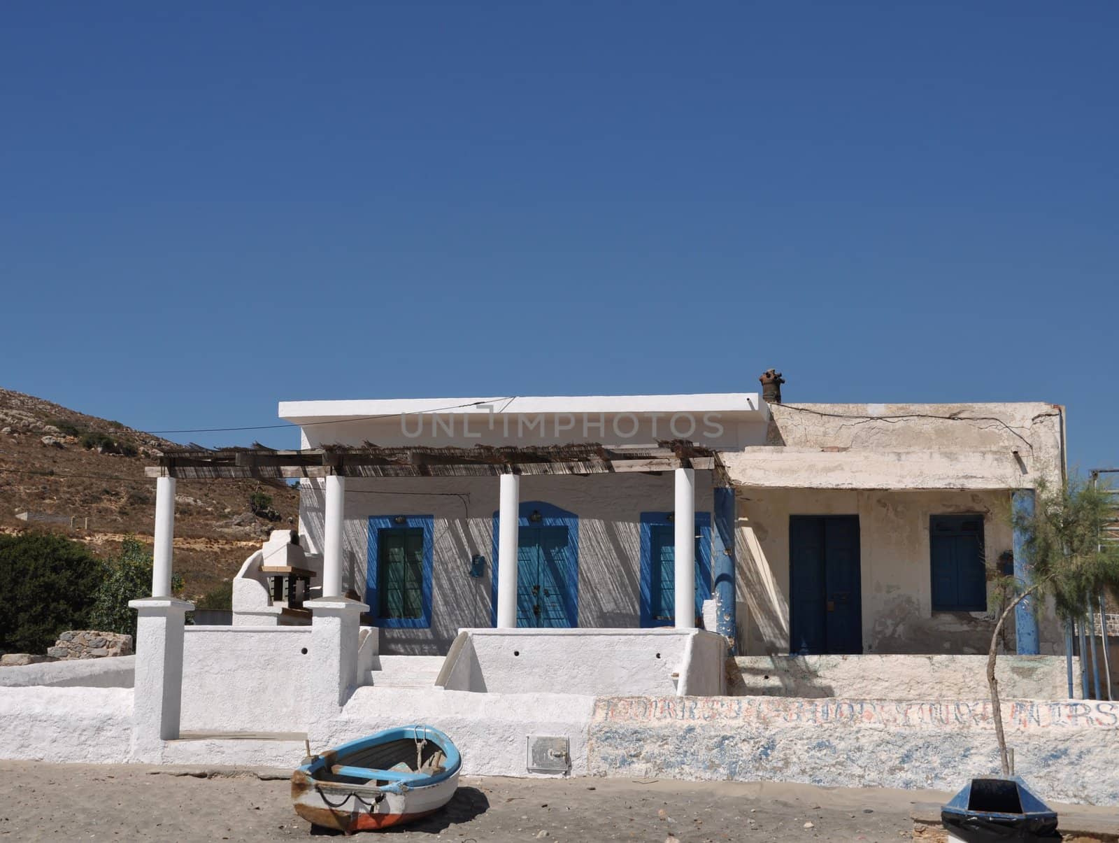typical blue and white greek house in Pserimos beach