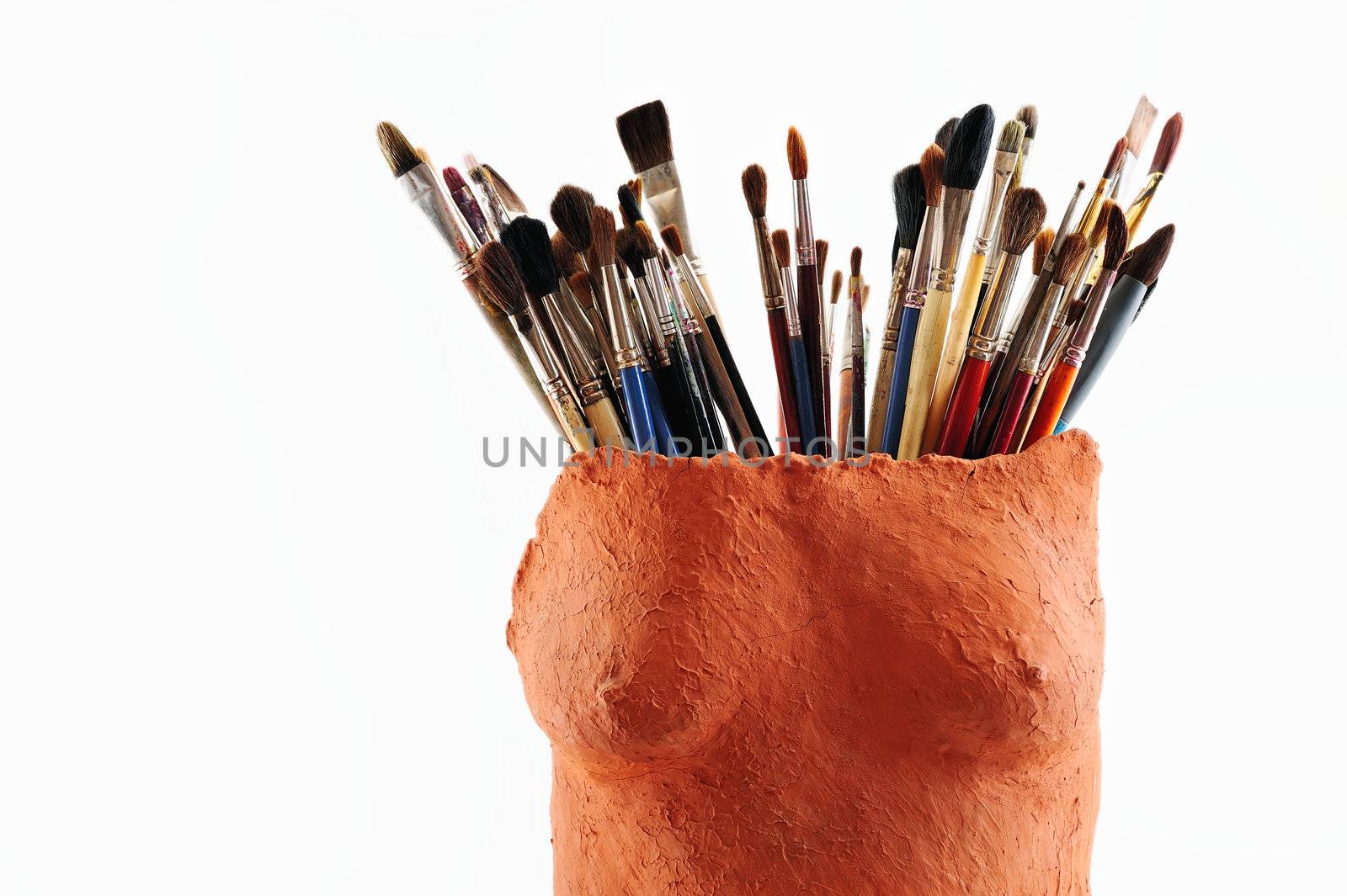 Collection of paintbrush in the ceramic vase