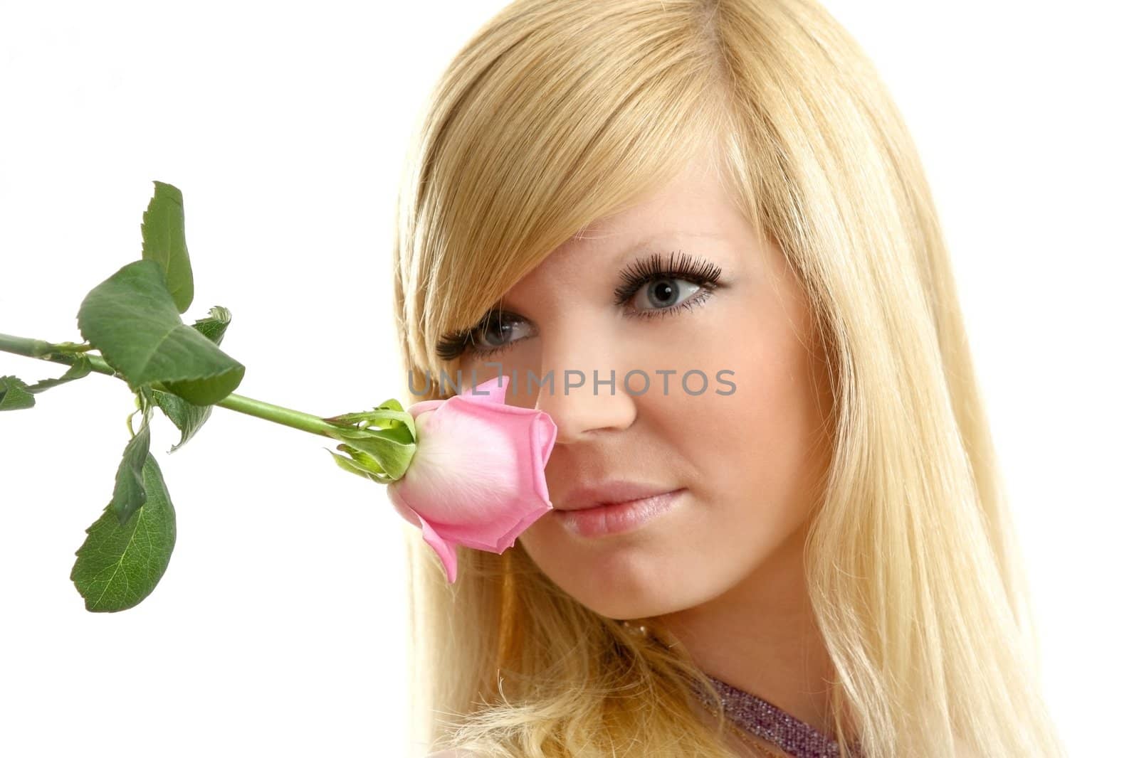 The beautiful girl with a flowing hair and a rose