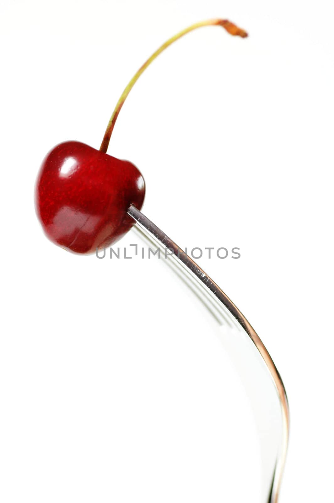 One red cherry on a Fork