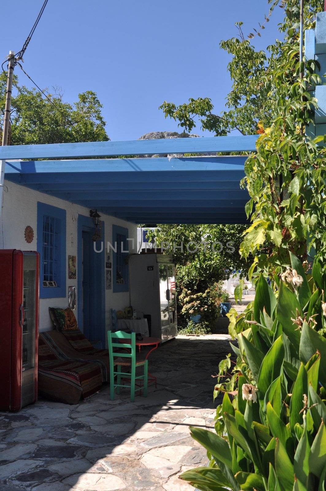 colorful and typical greek taverna scene in Zia (Kos island), Greece