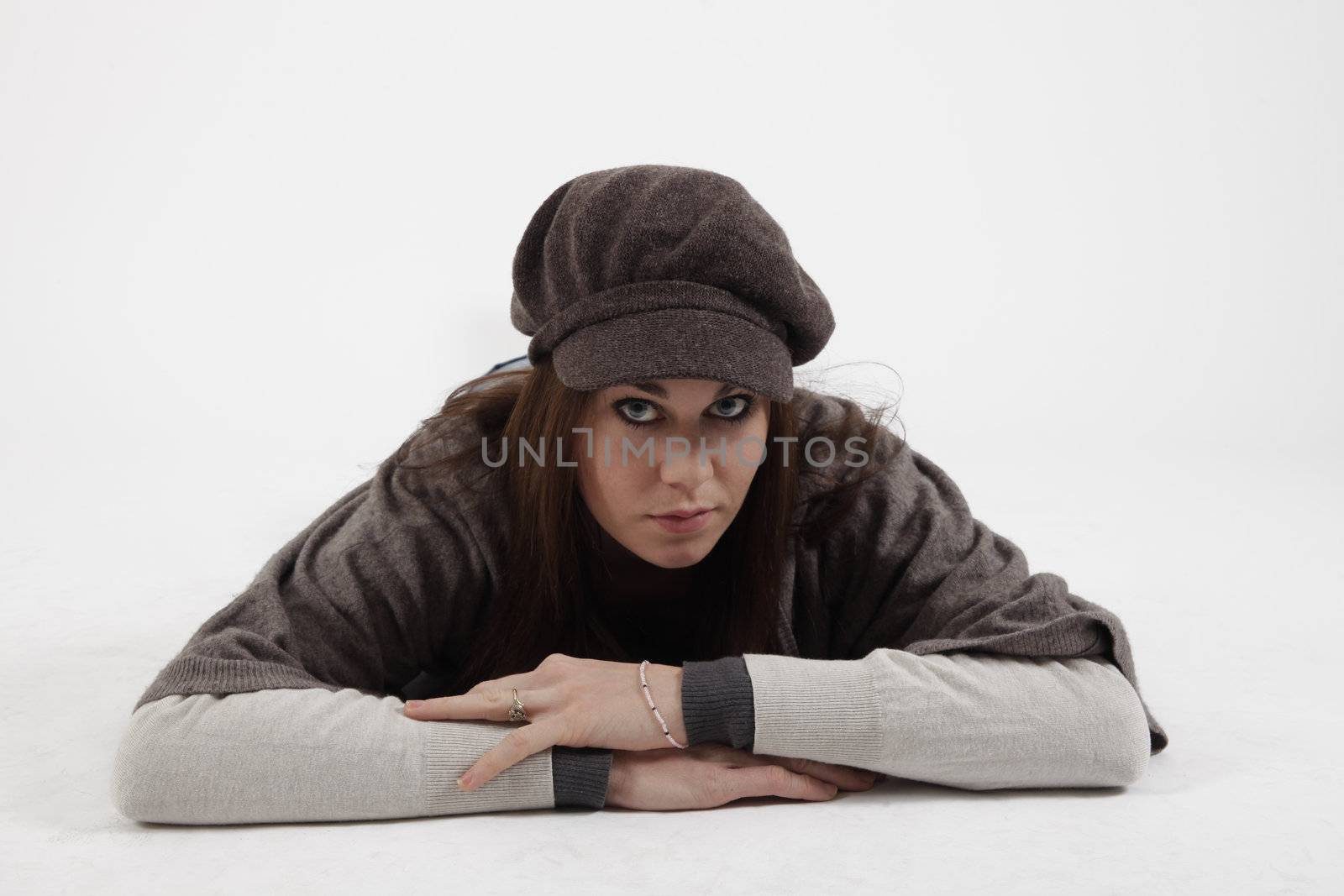 Young woman with cap looking at the camera by macintox