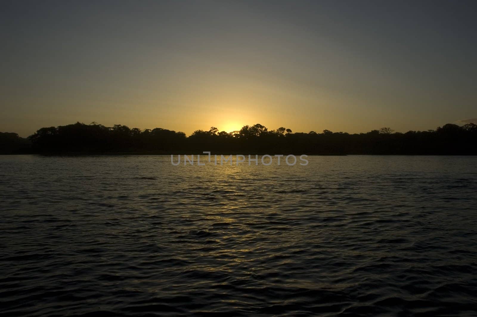 Sunset in Tortuguero, Costa Rica by vanessadevolder