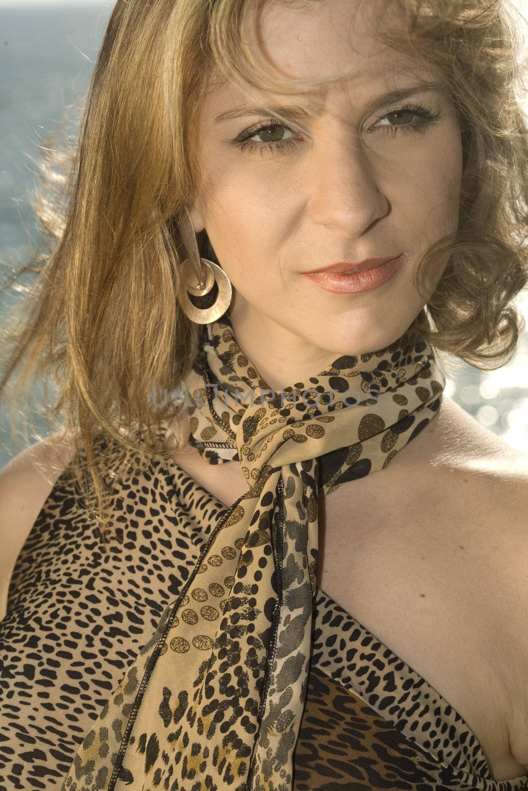A young blond brazilian woman in a leopard skin like blouse.