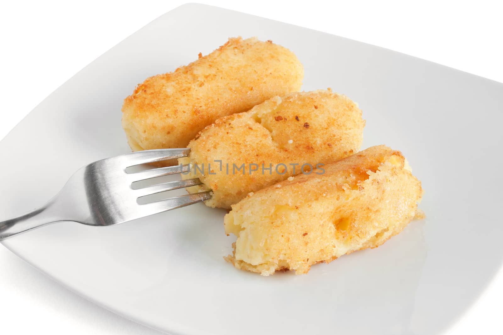 dish with potato croquettes isolated on white background with clipping path