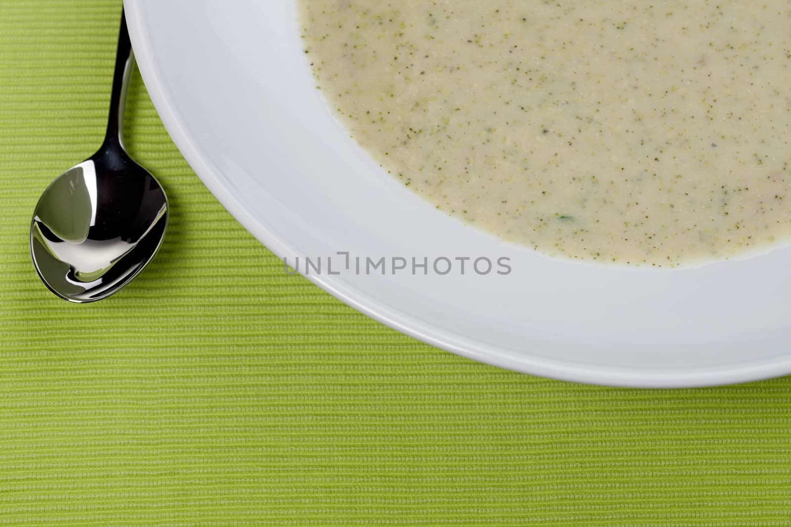 broccoli soup in a white plate by bernjuer