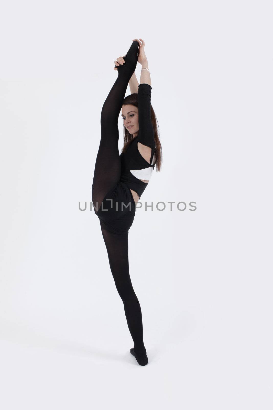 Young gymnast in black looking at the camera