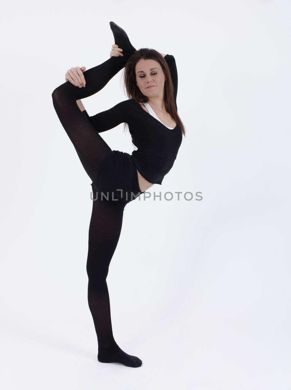 Young gymnast in black looking at the camera