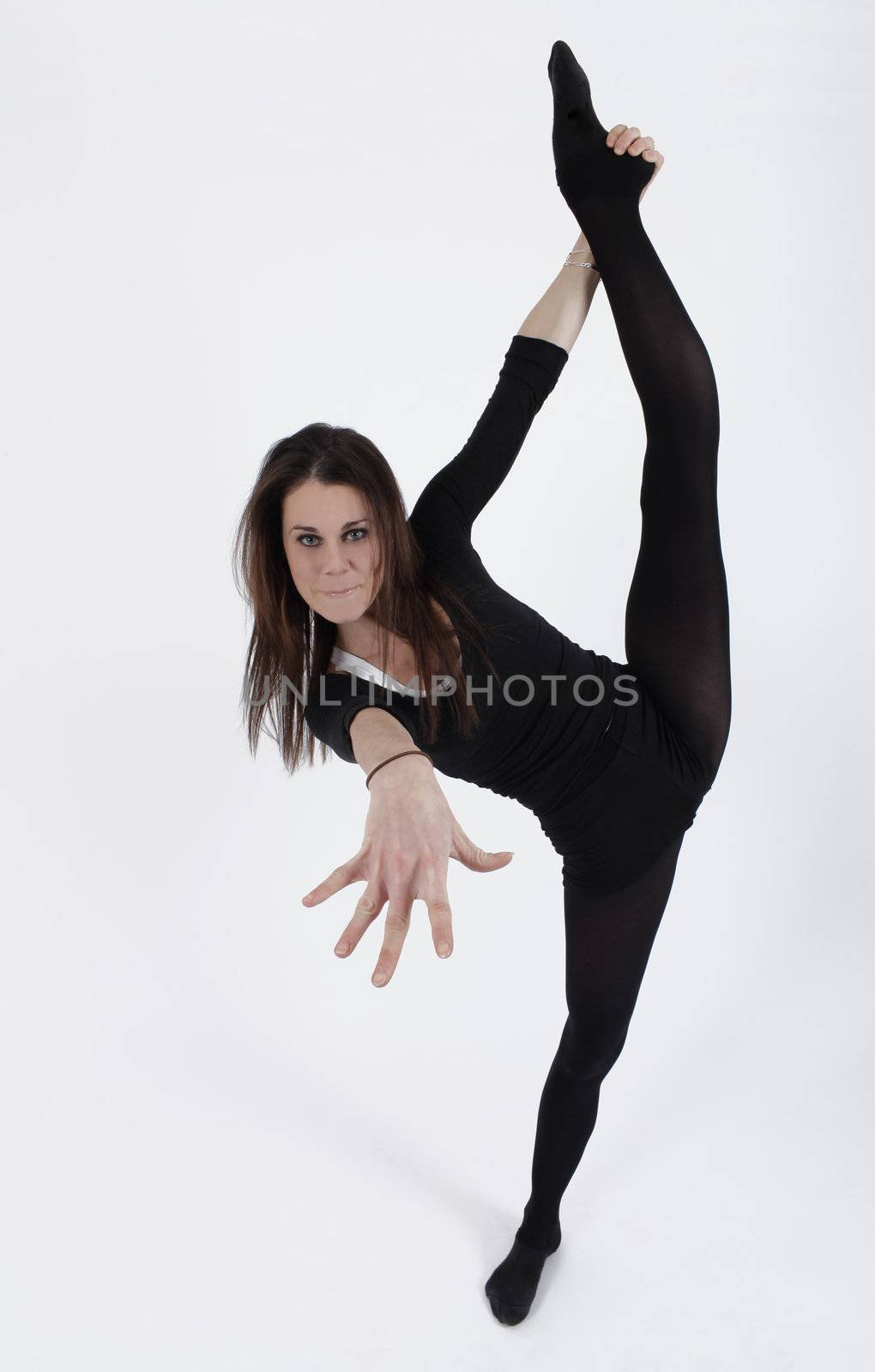 Young gymnast in black looking at the camera