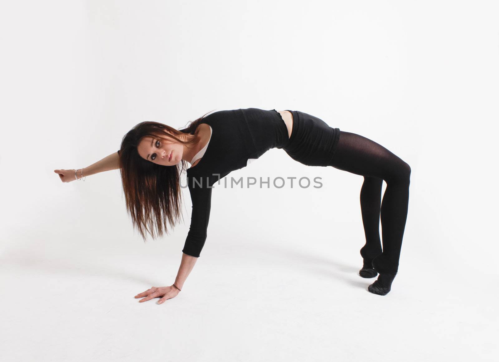 Young gymnast in black looking at the camera