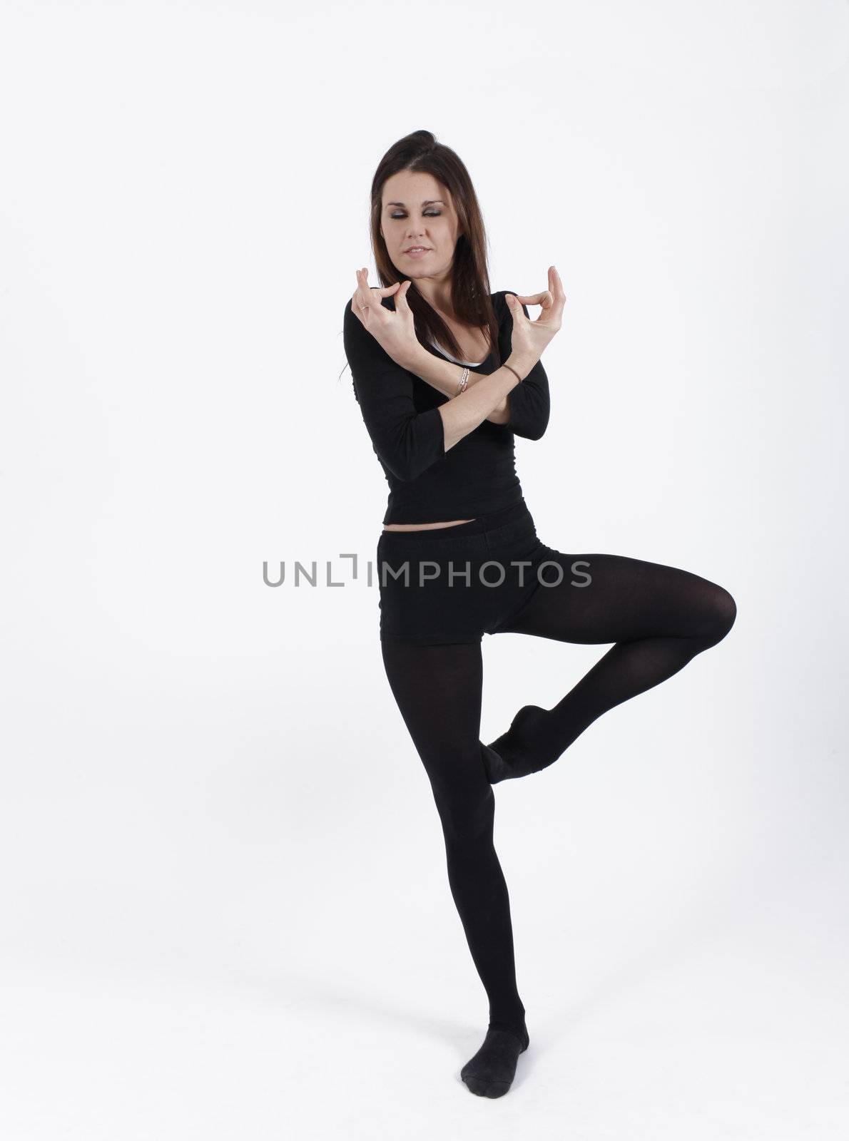 Young gymnast in black looking at the camera