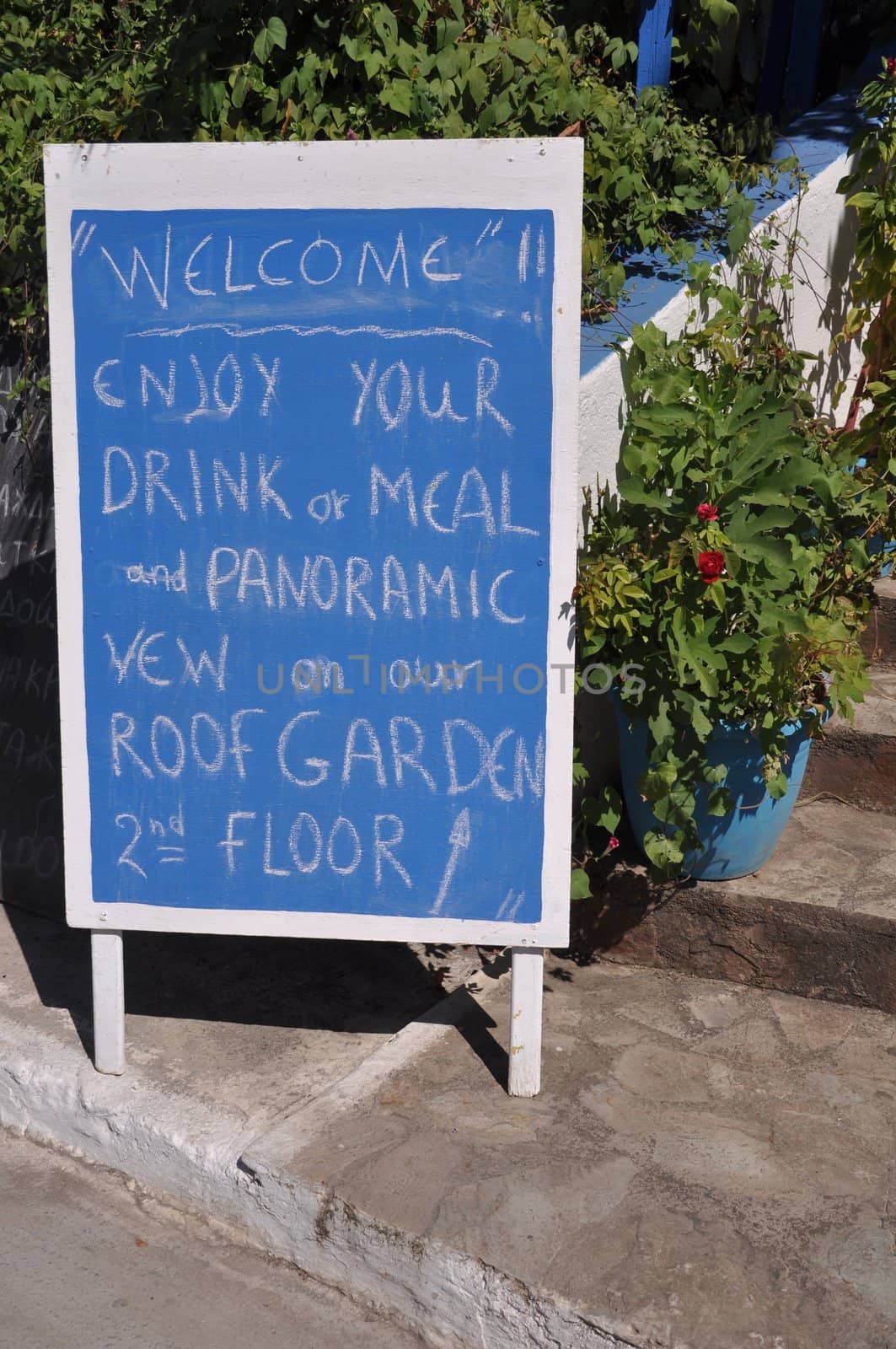 blue restaurant ad invinting tourists in Zia (Kos island), Greece