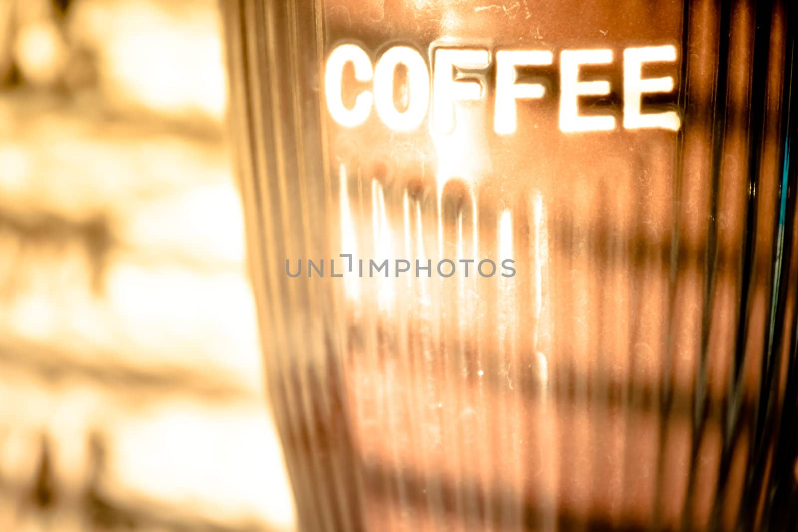 close up photo of coffee mug and window blinds reflection