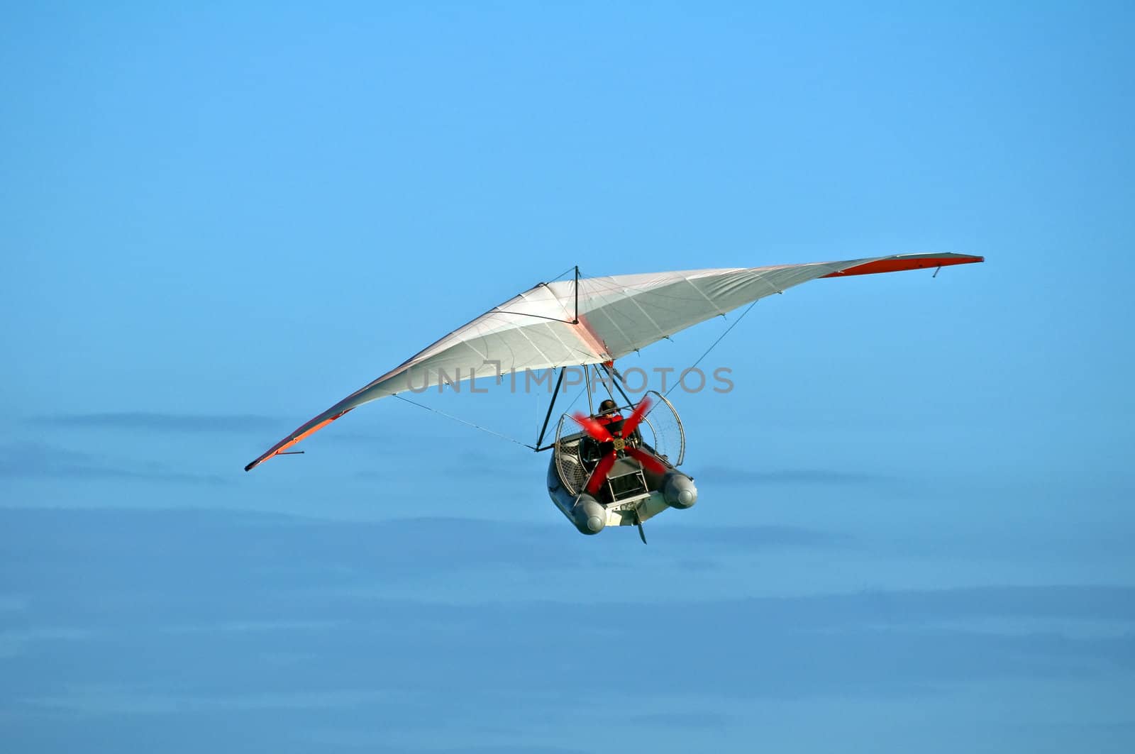 Hang glider boat flying over the Caribbean.