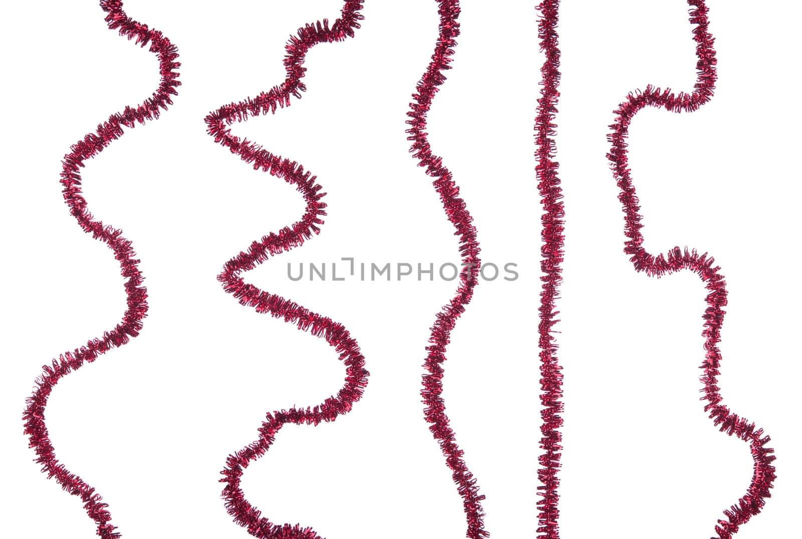 set of red Christmas tinsel decorations isolated on white background