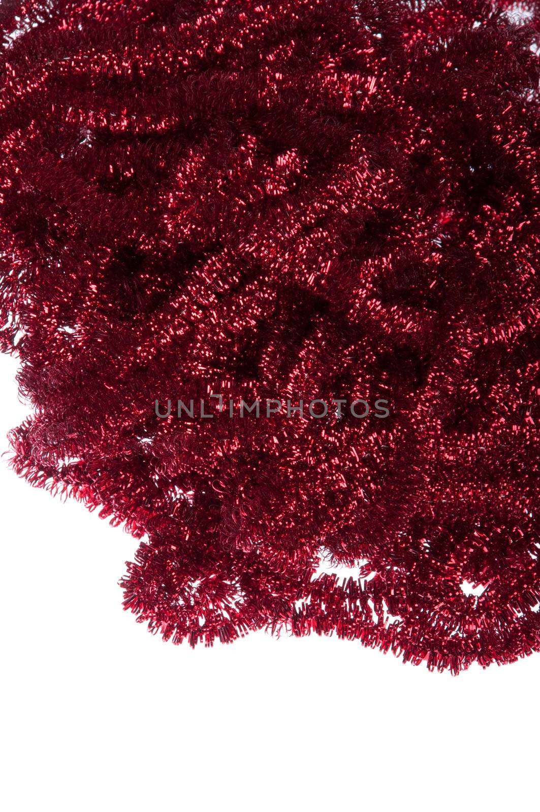 red Christmas tinsel decorations isolated on white background (copy-space available)