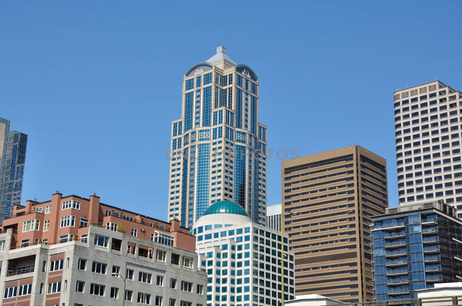 Downtown Seattle in the summer at noon, many styles of buildings.