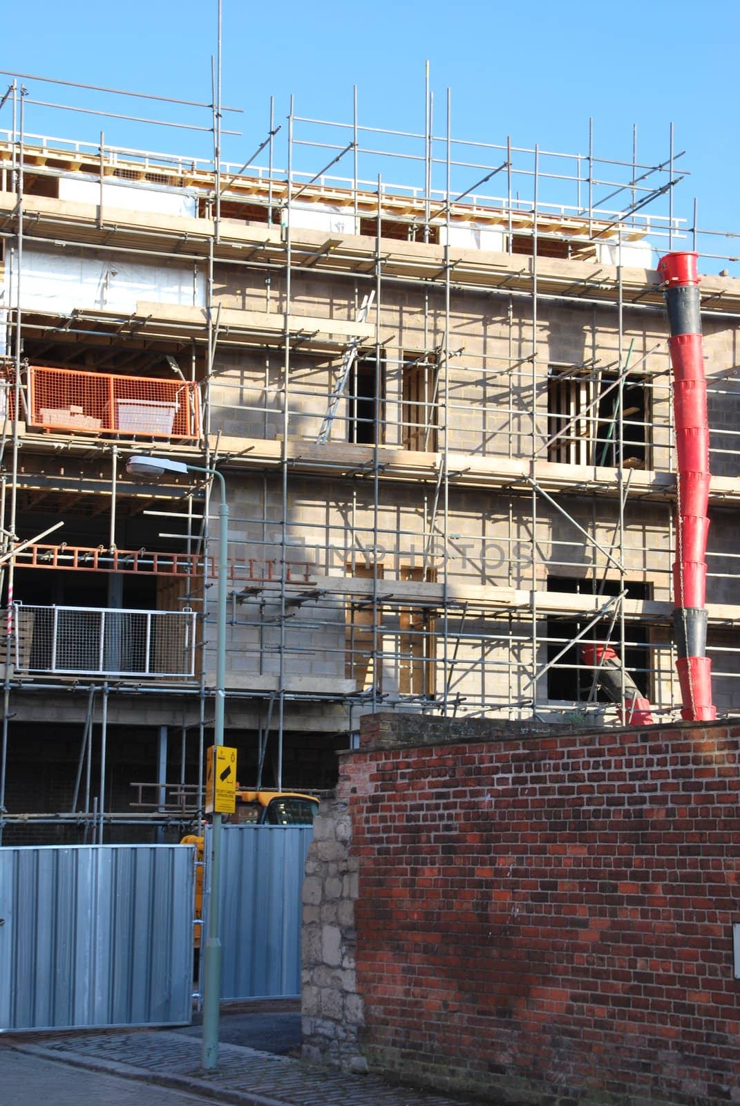 residential building under construction (blue sky background)