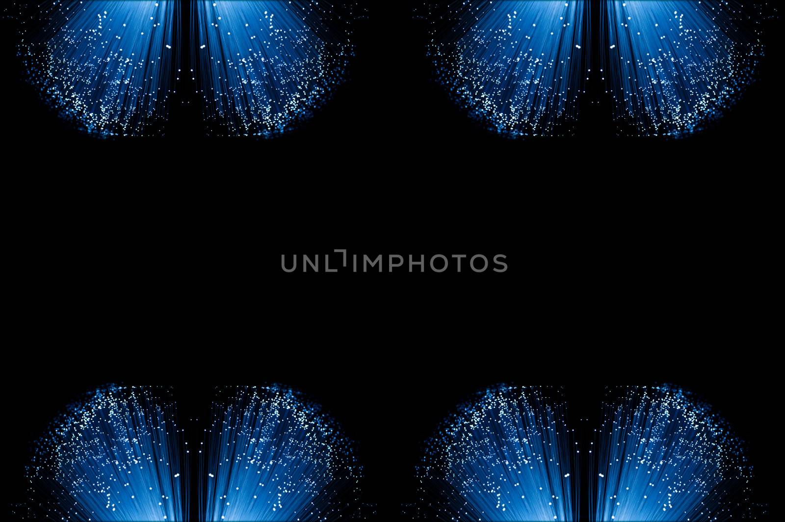 Eight small groups of illuminated fiber optic light strands arranged along the top and bottom border of the image with black background.