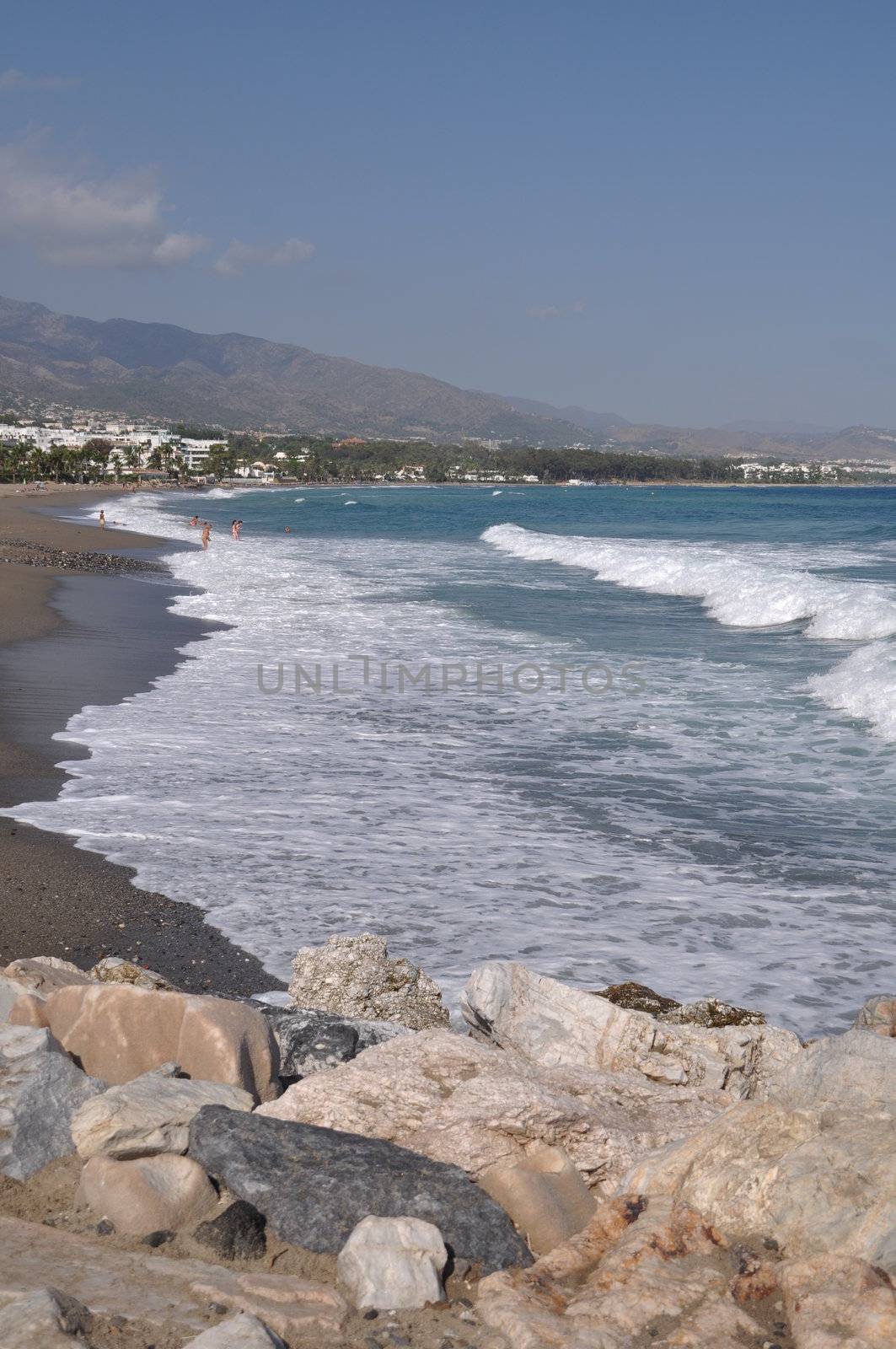 beautiful beach with stone pier in Puerto Banus (Marbella), Spain