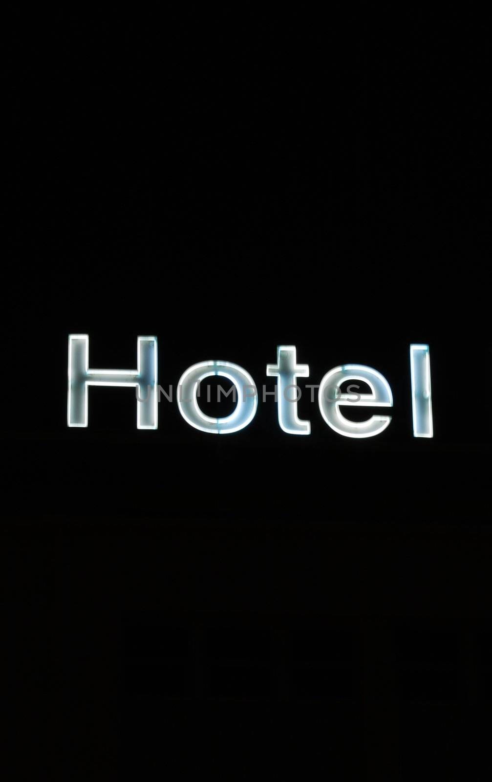 photo of a Hotel sign on black background