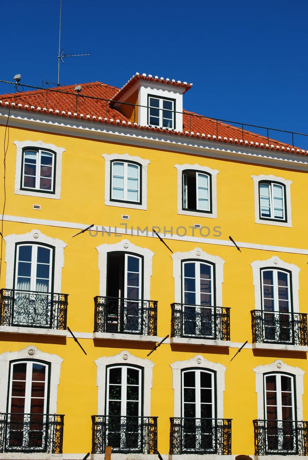 photo of a ancient and residential yellow building