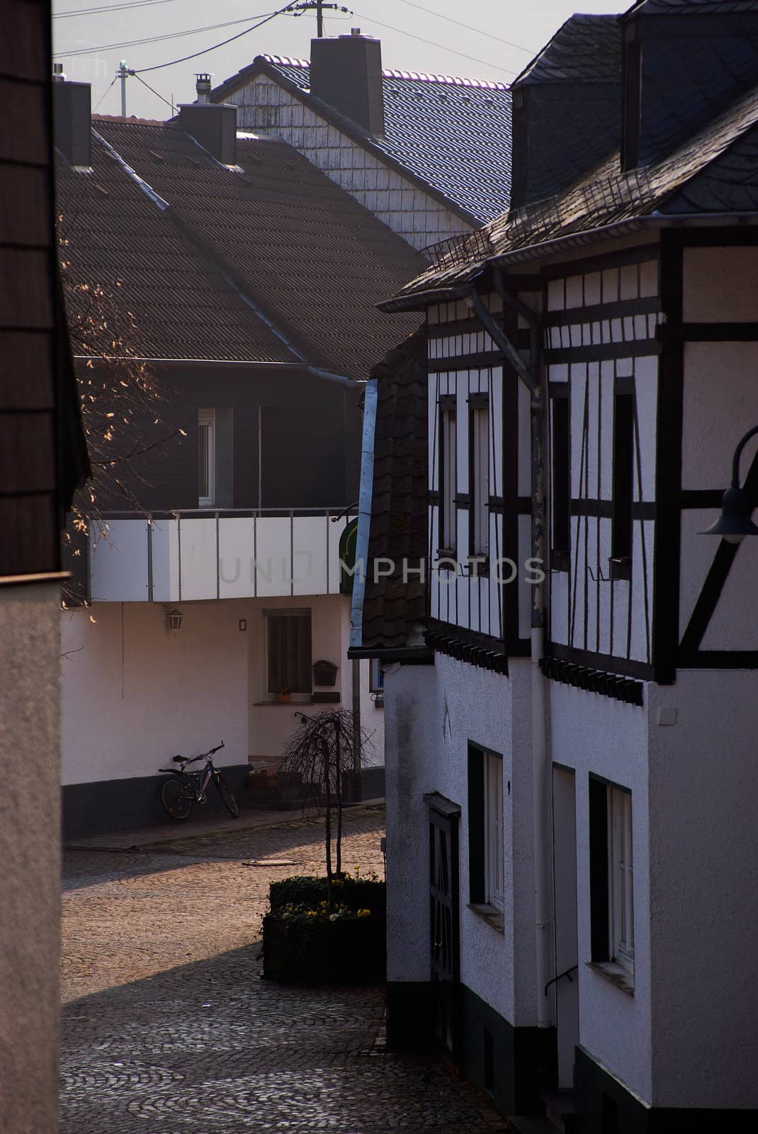 Morning, traditional German buildings, bike near the wall