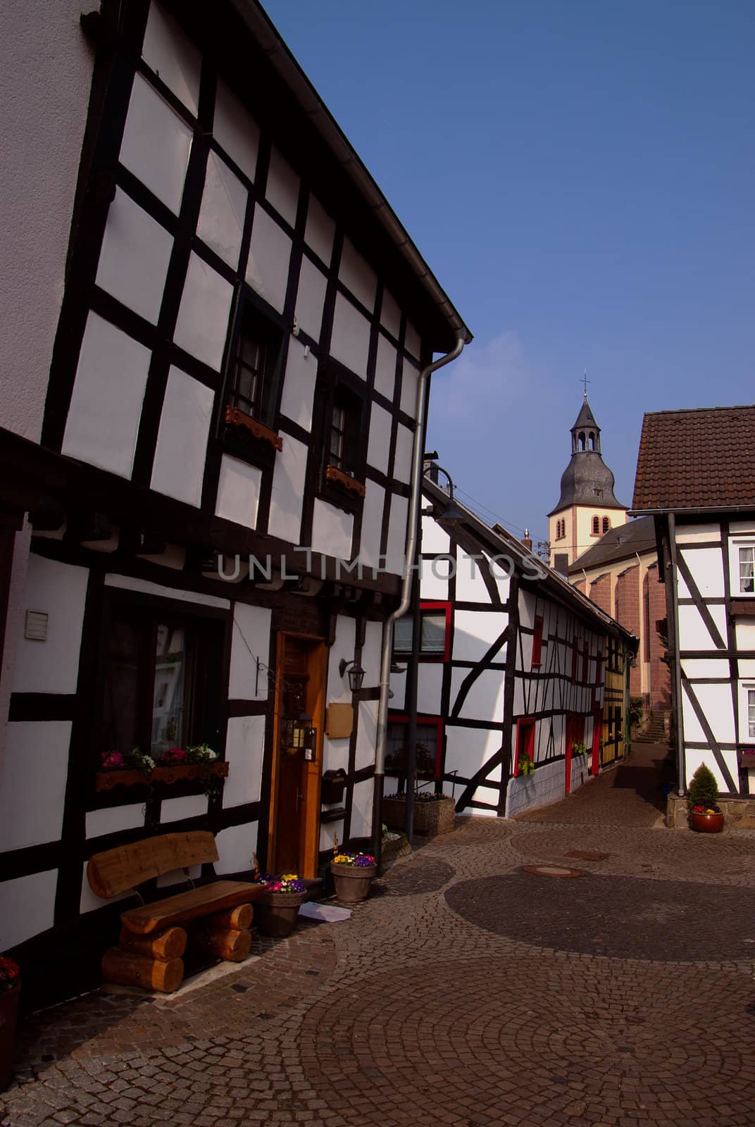 Traditional old house and church in town Heimbach, Germany