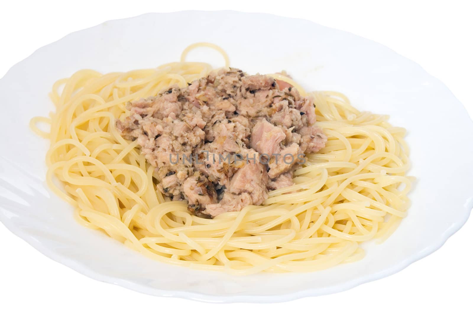 italian dish of spaghetti with tuna and origanum on white background