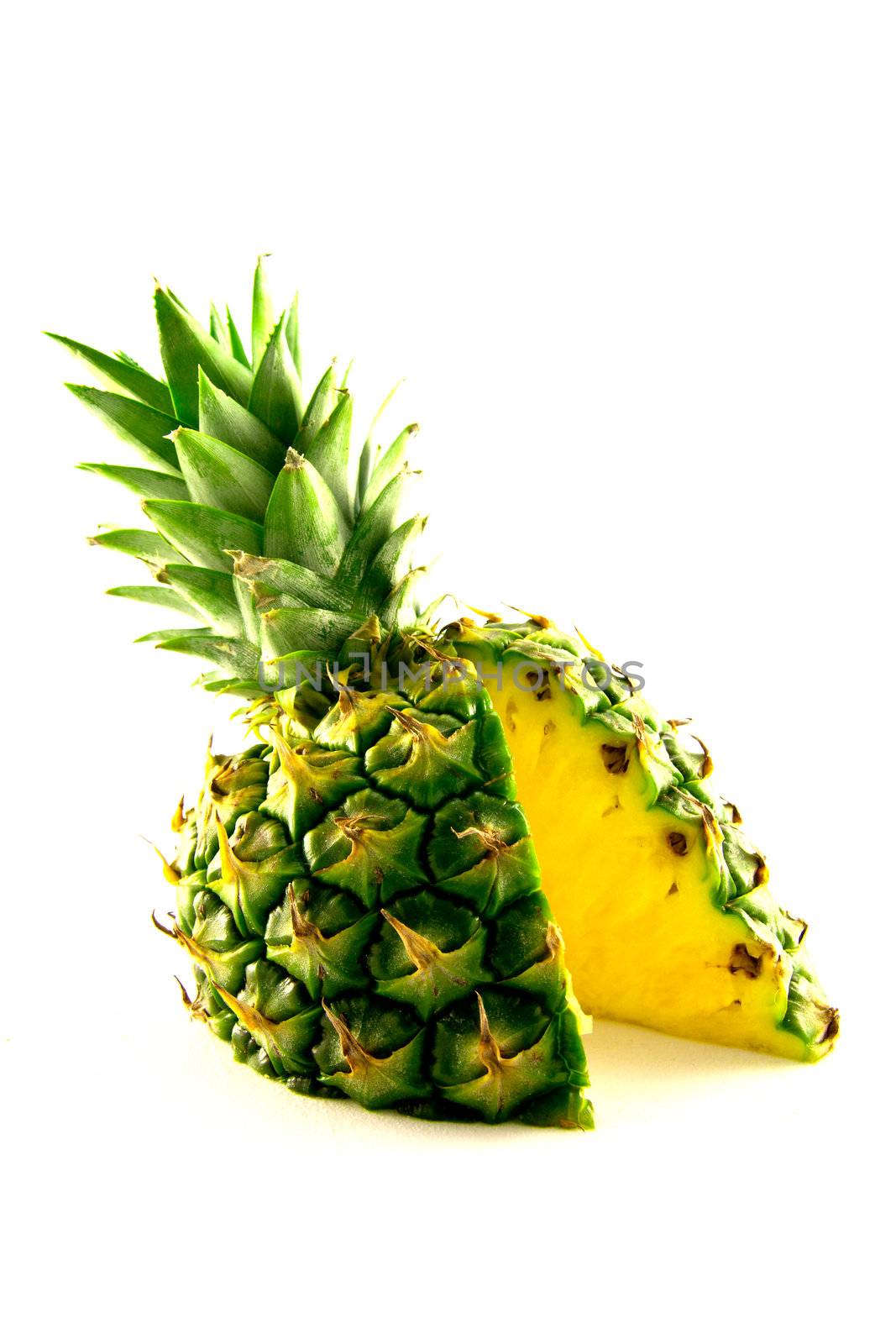 fresh delicious looking green pineapple fruit on a white background with a clipping path