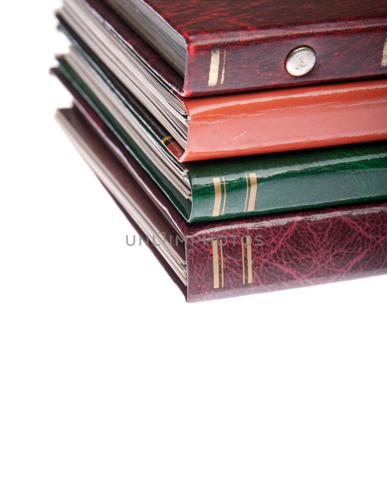 pile of antique photo albums isolated on white background