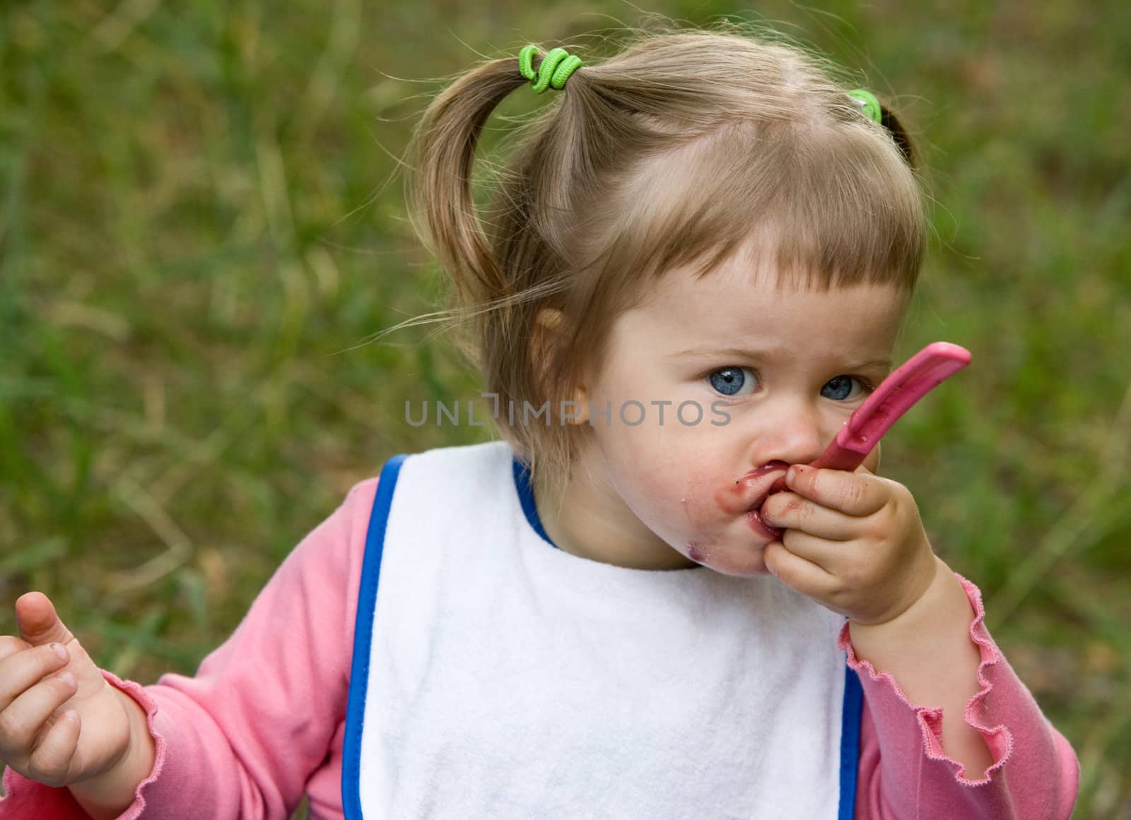 people series: little girl are eating fruit jam