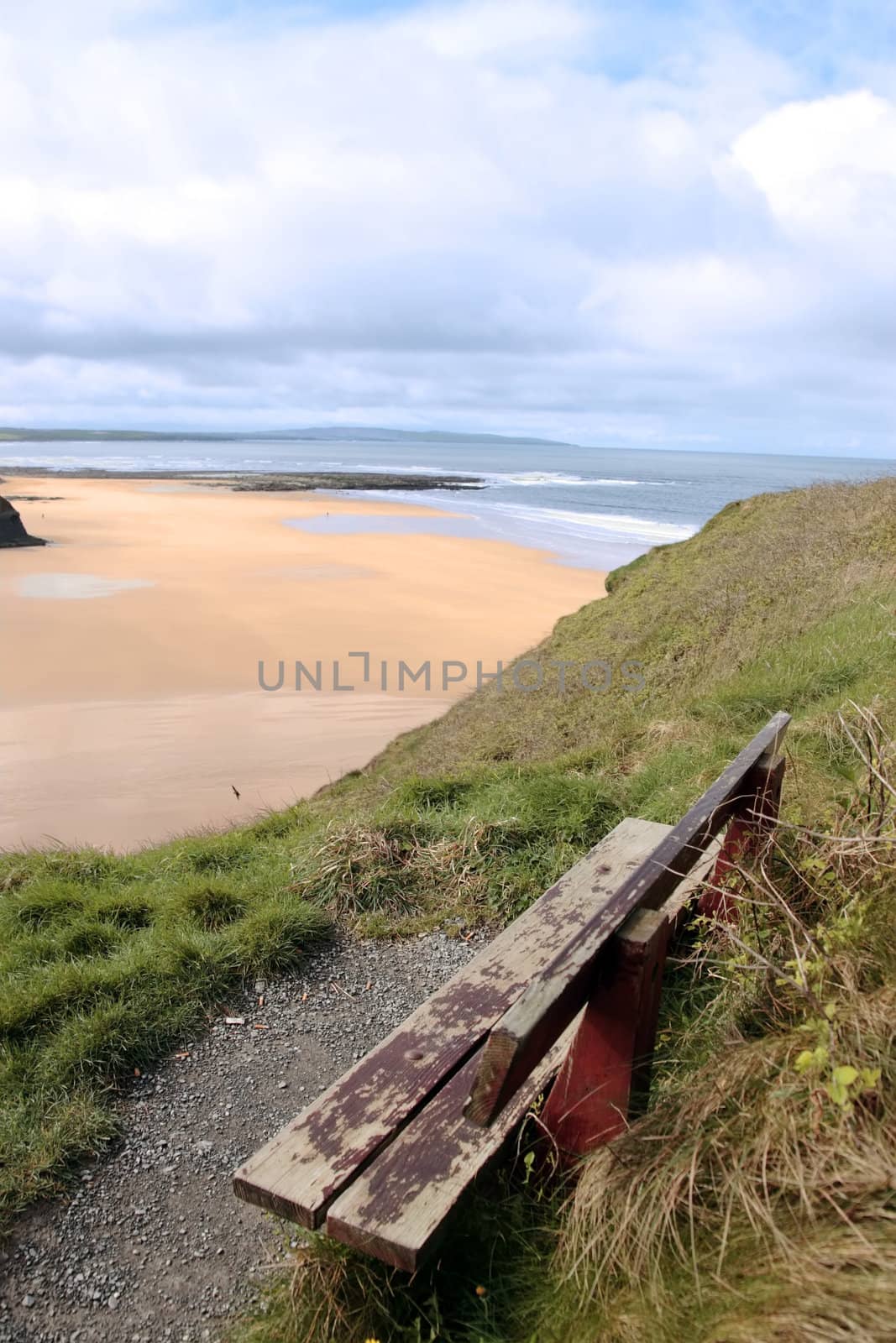 ballybunion bench in winter with view of castle beach and cliffs