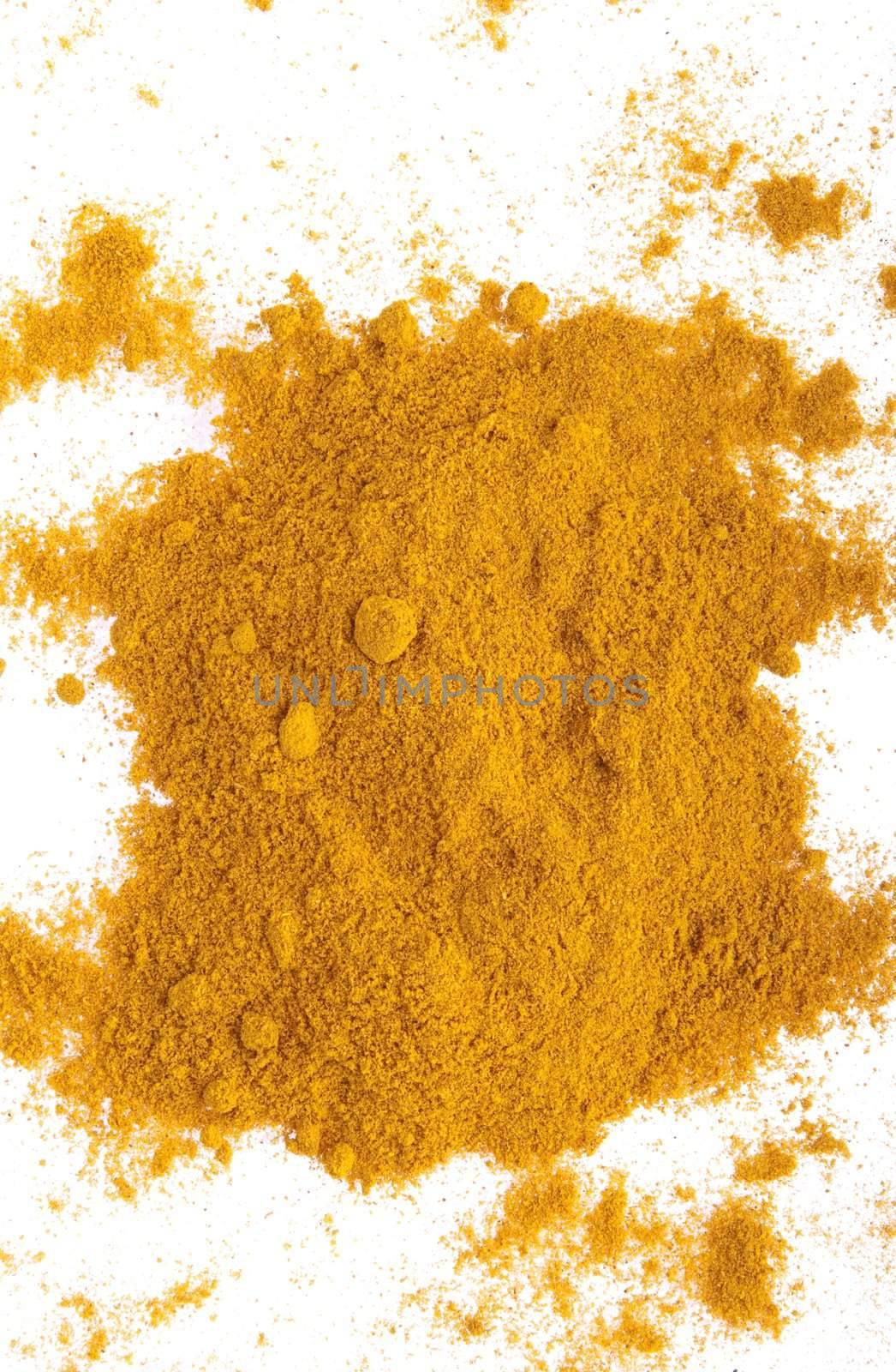 curry spice powder isolated on white background (chaotic version)