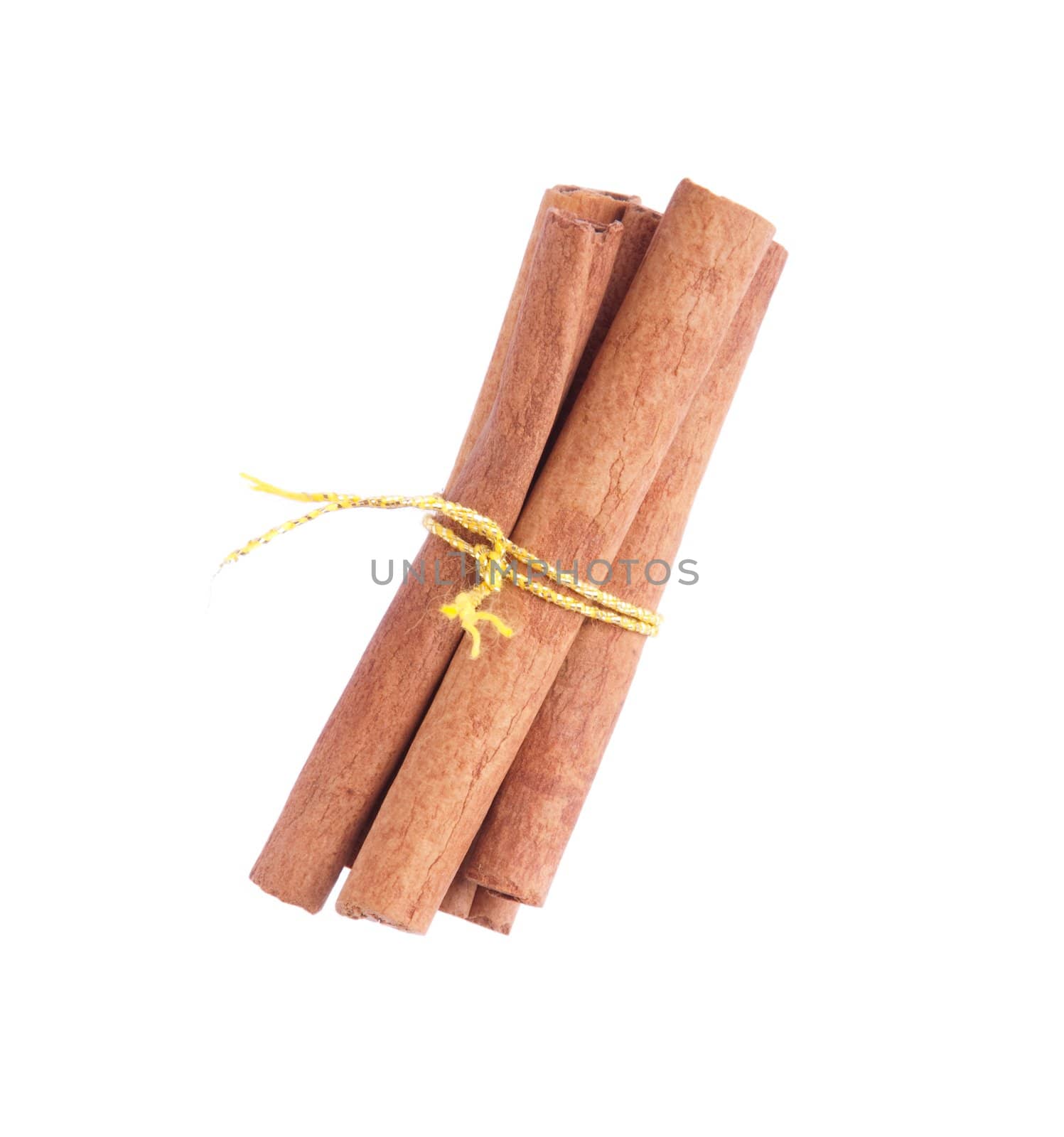 bunch of cinnamon sticks tied by yellow rope (isolated on white background)