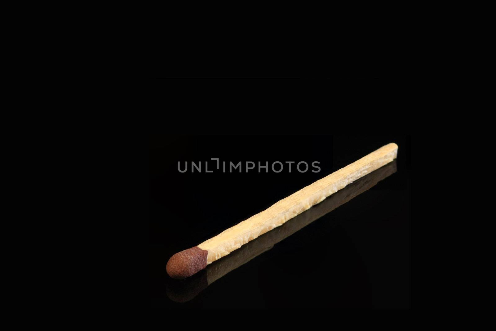 One match stick on black by ChrisAlleaume