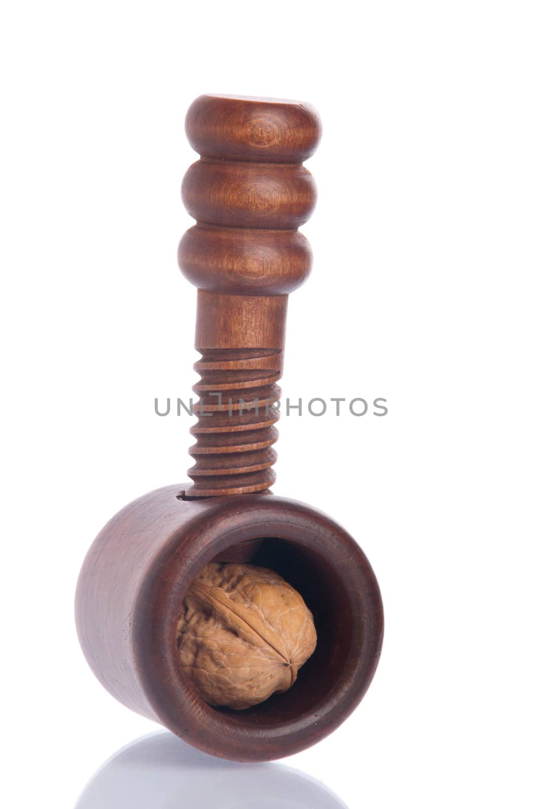 wooden nutcracker with walnut isolated on white background