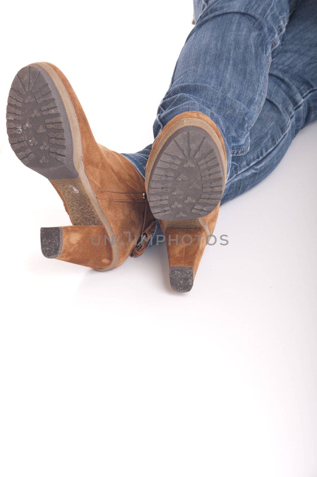 woman wearing leather fashion boots on white (shallow depth of field)