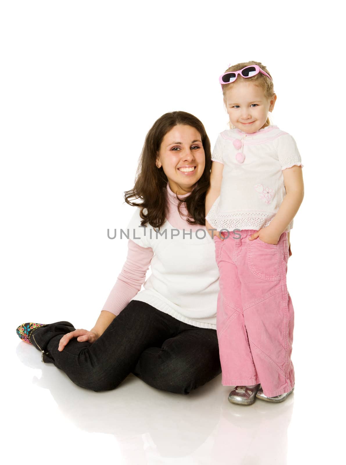 mother and daughter posing together  isolated on white