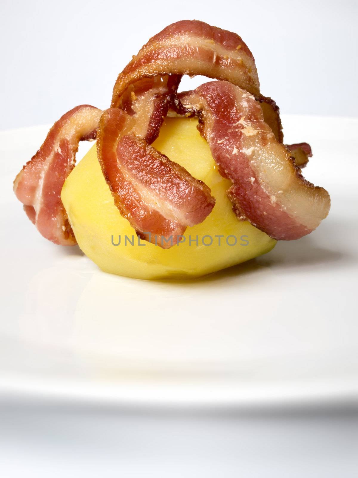 baked potato with bacon by zkruger