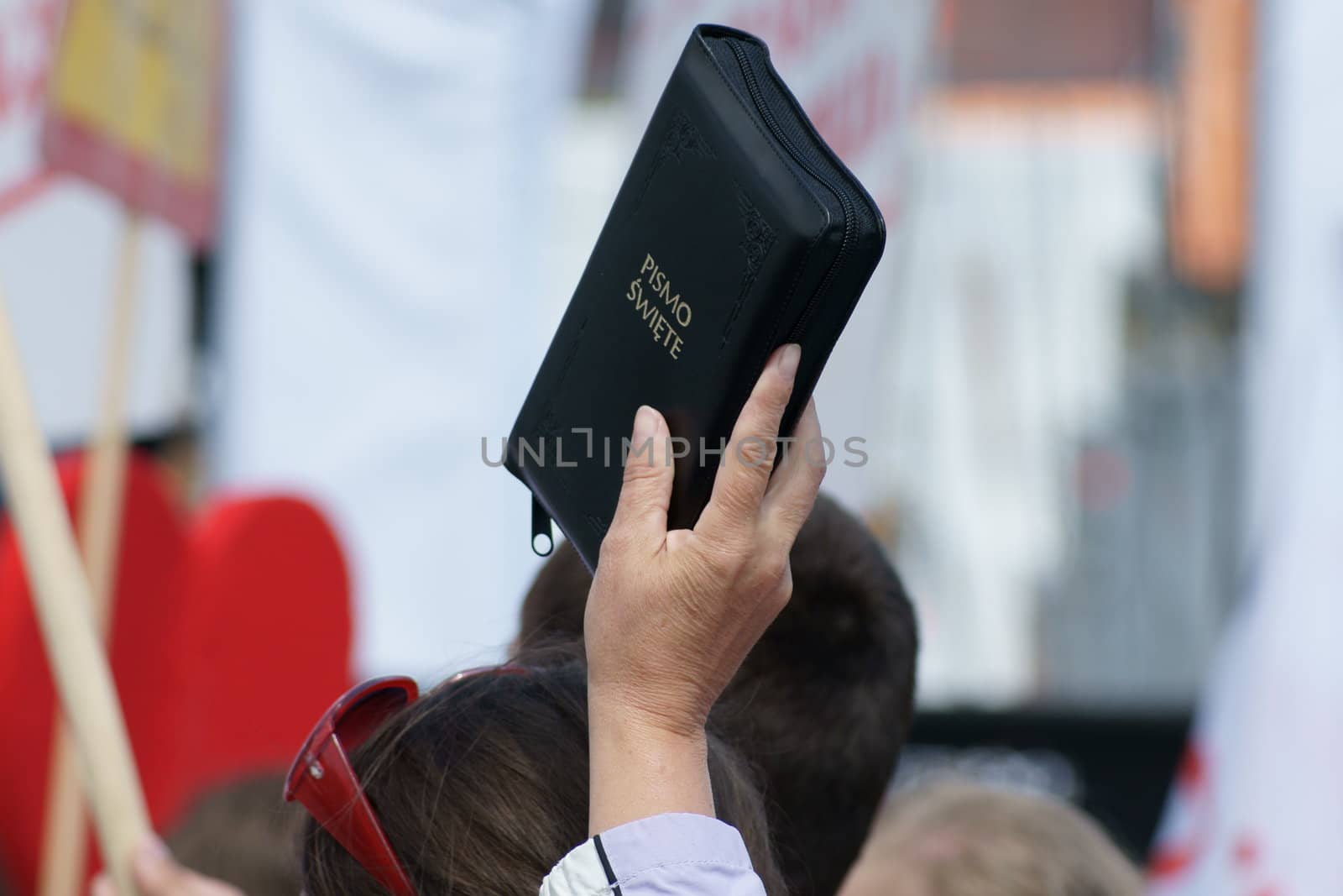 Warszaw, Poland - June 06: Woman who have a Sacred Scripture in Pilsudzkiego square on the Cross devotion Pope John  Paul II in the 20th anniversary of the Polish pope. About the pilgrimage: "Let your spirit come down and renew the  face of the earth"